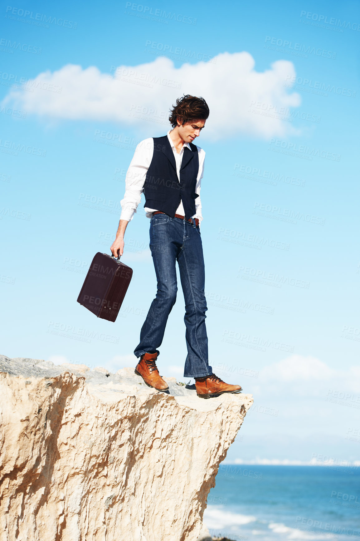 Buy stock photo Business man, summer and standing on a cliff by the beach for adrenaline, adventure or a break in nature. Thinking, walking and a worker or person on the edge of a rock or mountain at the ocean