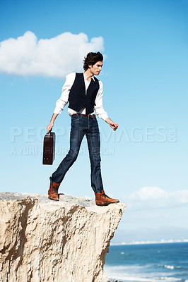 Buy stock photo Businessman, thinking and standing on a cliff by the beach for adrenaline, adventure or a break in nature. Idea, walking and a worker or person on the edge of a rock or mountain at the ocean