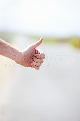 Buy stock photo Person, travel and hitchhike on highway for car, stop and adventure on road trip with transportation for freedom. Man, vacation and help with journey, countryside and hand sign in cape town in mockup