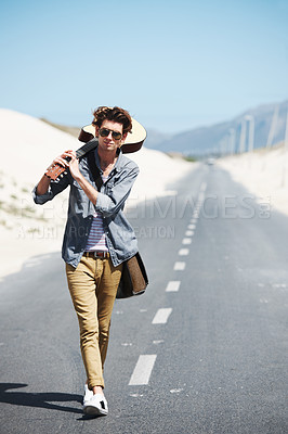Buy stock photo Walking, musician and man with a guitar on a road trip, highway or journey in countryside. Guitarist, trekking or lost on adventure and explore path in landscape with freedom on holiday or vacation