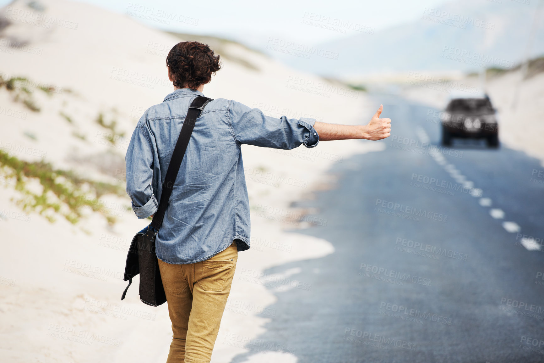 Buy stock photo Man, travel or hitchhiking on highway for car, stop or adventure on road trip with transportation for freedom. Young person, summer or countryside for help with journey, cape town or outdoor