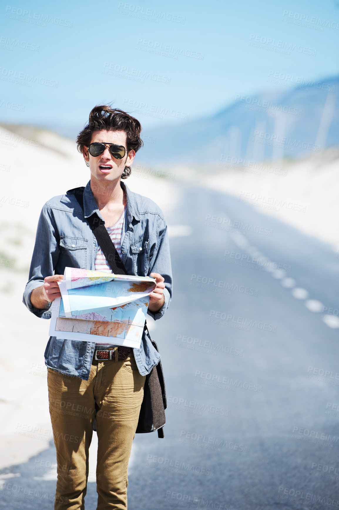 Buy stock photo Lost, man and reading a map on a road trip, journey or planning travel on a highway. Check, location and confused person with destination on adventure or search countryside for direction to city