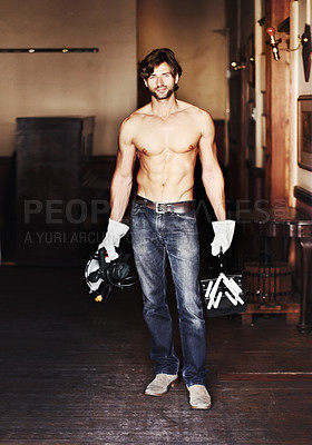 Buy stock photo Portrait, diy and a handsome shirtless handyman holding equipment indoor for home improvement. Maintenance, renovation and service with a sexy male construction worker standing topless in a house