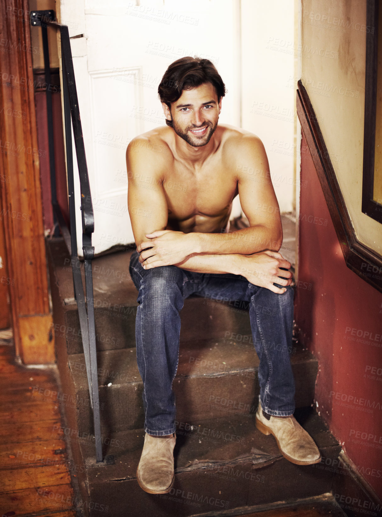 Buy stock photo Happy portrait, shirtless and a sexy man on stairs with a smile, confidence and positive mindset. A happy male model person sitting on steps for art deco, fitness and fashion in apartment or house