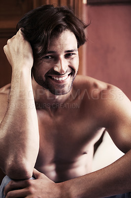 Buy stock photo Portrait, man and smile after waking up in bedroom with happiness on face on vacation, trip or holiday. Young person, relaxed and alone with thinking for excitement on break while shirtless in home