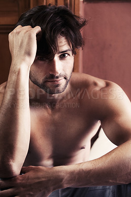 Buy stock photo Portrait, man and serious shirtless in bedroom with look on face while thinking. Young, male person and alone in home with stare after wake up on vacation, holiday or break in morning for relaxation