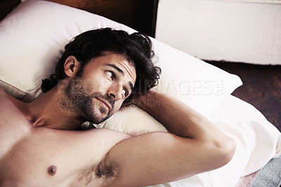 Buy stock photo Man, lying and wake up in bed while thinking, idea or planning of activities on vacation in room. Young person, face and relaxed for rest, shirtless and looking to side with vision for holiday