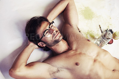Buy stock photo Sexy young artist lying on a large sheet of paper and thinking