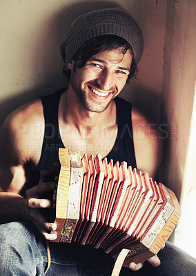 Buy stock photo Portrait, happy man and musician with smile for accordion for music, love or hobby in room. Young person, instrument or practice by joyful expression on face for play, entertainment or performance