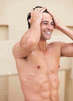 Buy stock photo Man, shower and hair with smile, bathroom and happy with hygiene, self care and morning for skin routine. Young guy, body cleaning and healthy for skincare, wellness and water drops in apartment