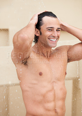 Buy stock photo Shot of a handsome young man enjoying a refreshing shower