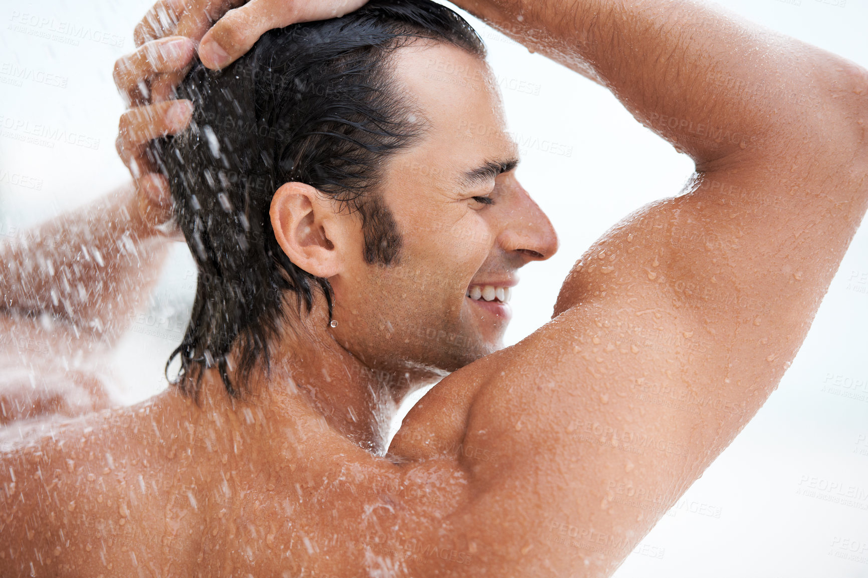 Buy stock photo Shower, happy and man with water for cleaning, washing hair and grooming for healthy skin. Beauty, spa treatment and person smile with splash for hygiene, wellness and skincare hydration and cleanse