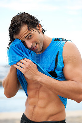 Buy stock photo Man, fitness and wipe away sweat, portrait and wellness with runner outdoor, cardio and break after workout. Smile, tired and training with health, abs and bodybuilding, muscle and sports athlete