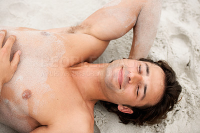 Buy stock photo Man, smile and lie beach sand relax or summer vacation calm, tropical destination or holiday fresh air. Male person, happy and shirtless at ocean alone for outdoor peace, sunshine lazy or travel fun