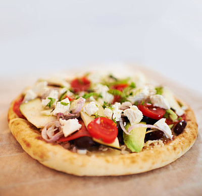 Buy stock photo A tasty pita bread topped with a range of fresh ingredients