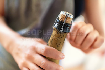 Buy stock photo Hands, person and open cork on bottle of wine, champagne and alcohol for party, celebration and congratulations for special event. Closeup, drink and pop muselet, wire cage and cap of liquor beverage