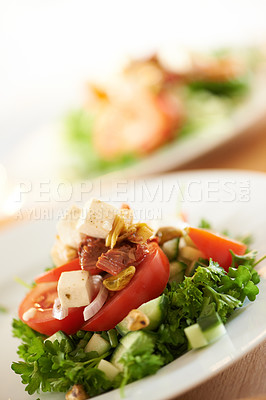 Buy stock photo Plate, closeup and a salad on a table for lunch, nutrition or eating to a a diet. Zoom, health and vegetable, dinner and an arrangement of food for detox, cooking or hungry with a dish for brunch