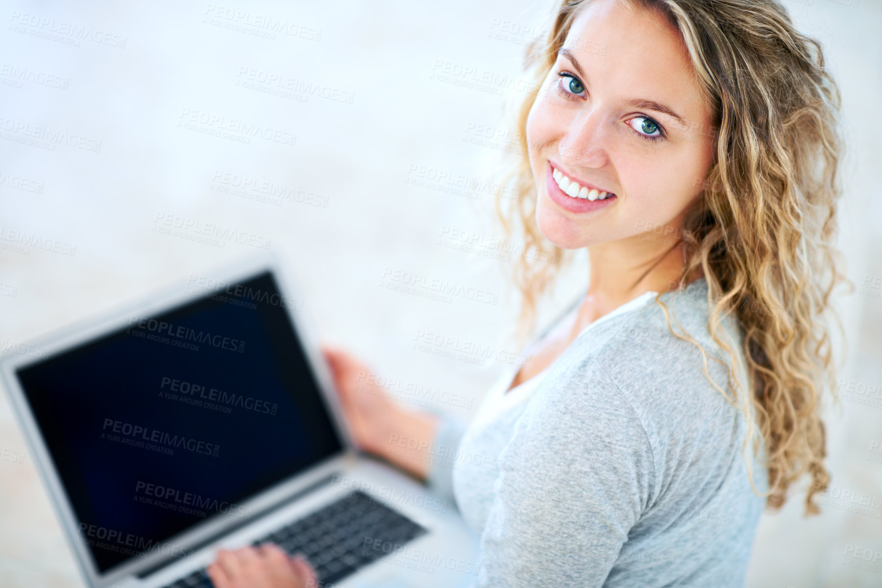 Buy stock photo Laptop, portrait and happy woman in home, typing email and internet. Computer, face and smile of girl in living room on social media, website or online communication on tech to relax on mockup space