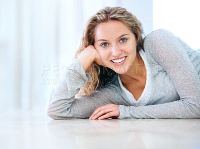 Buy stock photo Woman, portrait and floor relax smile in home for cheerful friendly, calm or lounge look. Female person, happy face and lying ground for sweet attractive, lazy weekend or positive posing in Canada