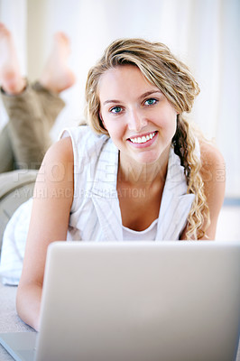 Buy stock photo Laptop, portrait and happy woman in home on floor, typing email and network on internet. Computer, smile and face of person or girl on social media, website and communication on digital tech to relax