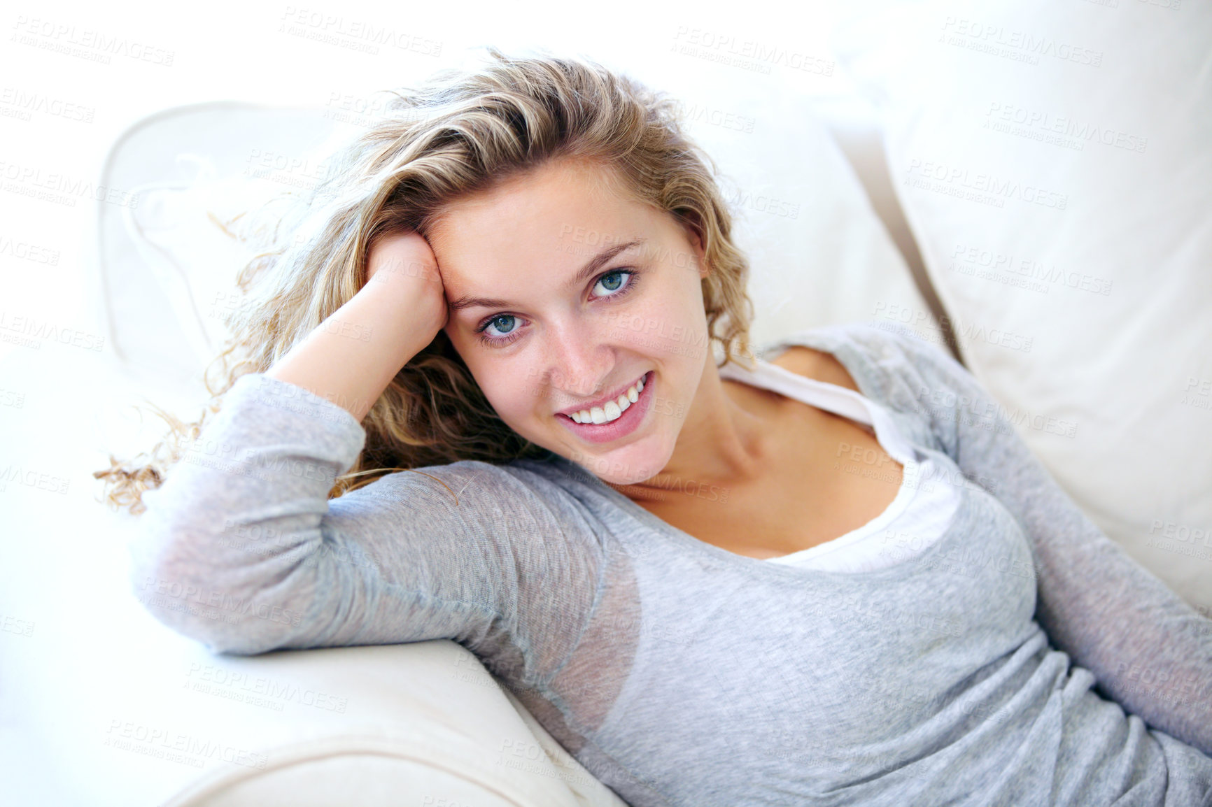 Buy stock photo Woman, portrait and smile on couch for lazy relax weekend, comfortable day off or cosy. Female person, face and tranquility solitude pose on apartment sofa for calm, positive mood or break in Canada