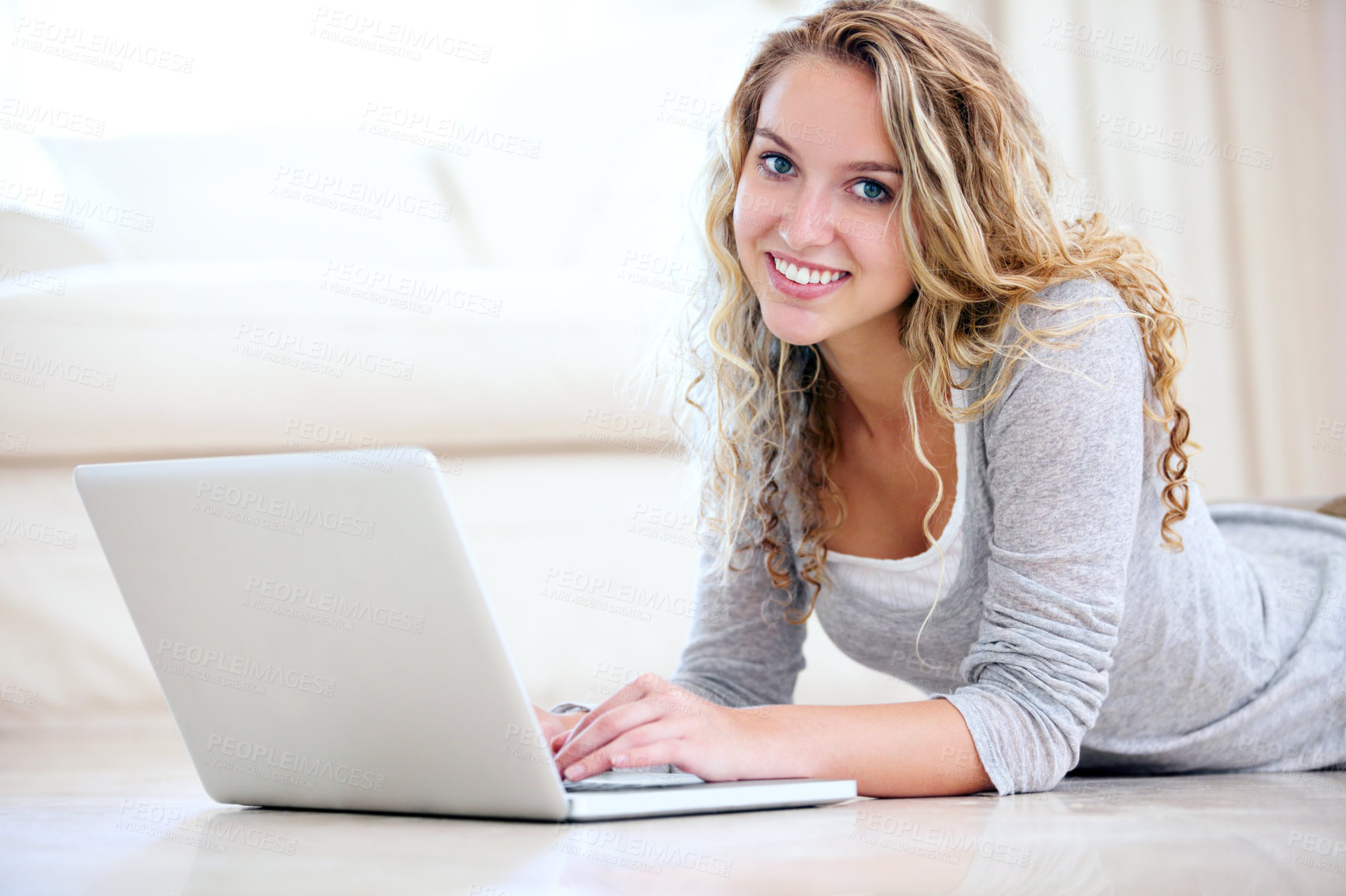 Buy stock photo Laptop, happy and woman typing on floor in home, reading email or network on internet. Computer, person and girl smile in living room on social media, online or communication on technology to relax