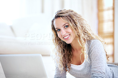 Buy stock photo Laptop, portrait and happy woman on floor in home, typing email and network on internet. Computer, face and smile of girl in living room on social media, website and communication on tech to relax
