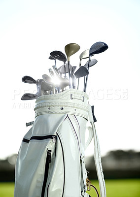 Buy stock photo Golf bag, sports and clubs outdoor on course for training, workout or summer sport on green field sunset mockup. Golfer, bags and equipment for game, competition or exercise with blue sky lens flare.