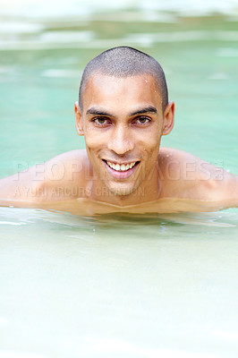 Buy stock photo Portrait of a handsome young man in a swimming pool