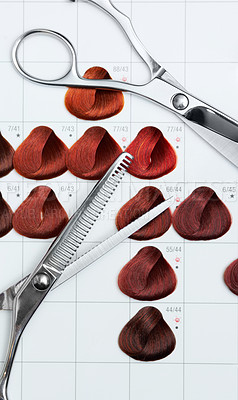 Buy stock photo A hair colour chart depicting various reds and two pairs of scissors