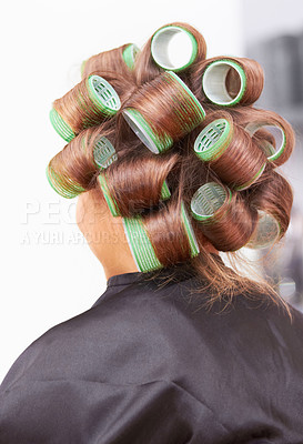 Buy stock photo Hair care, woman in salon with curlers for beauty and luxury hairstyle at professional service from back. Haircare, rollers and girl at hairdresser with tools for wellness, color and style at spa.