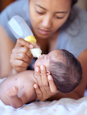 Buy stock photo Mother, baby and feeding milk from bottle for nutrition, health and wellness. Formula, newborn and mom feed child for early childhood development, growth and healthy diet, food and lunch at home.