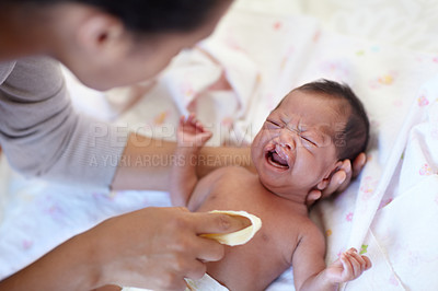 Buy stock photo Newborn, crying and cleft palate with cleaning, mom and bed with parent, sick and frustrated. Medical issue, syndrome and home bedroom for healthcare, childcare and mouth for baby, pain and sadness