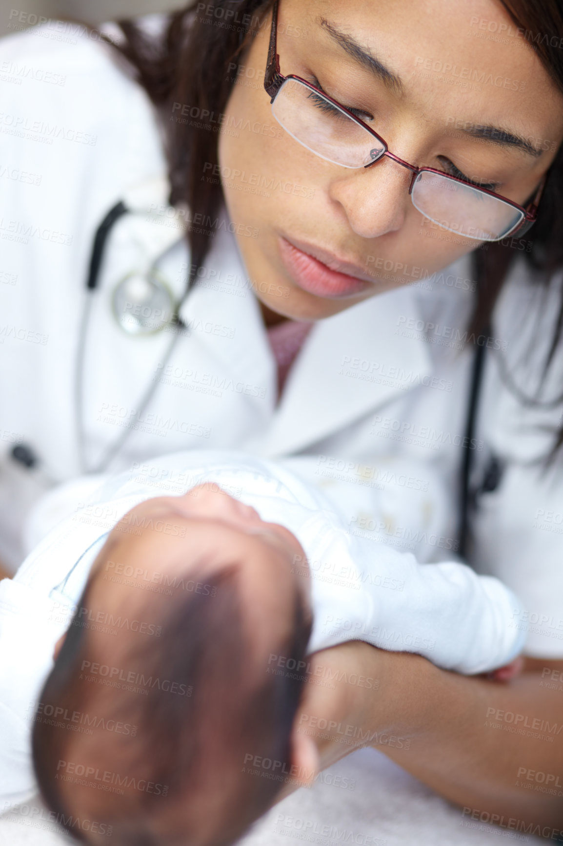 Buy stock photo Healthcare, medical and a pediatrician with a baby in the hospital for insurance, care or treatment. Medicine, children and a doctor woman holding a newborn infant in a health clinic for a checkup