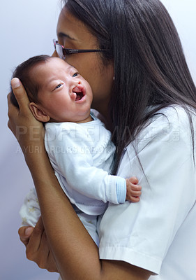 Buy stock photo Healthcare, cleft palate and a pediatrician with a baby in the hospital for insurance, care or treatment. Medical, kids and a doctor woman holding a newborn with a disability in a health clinic