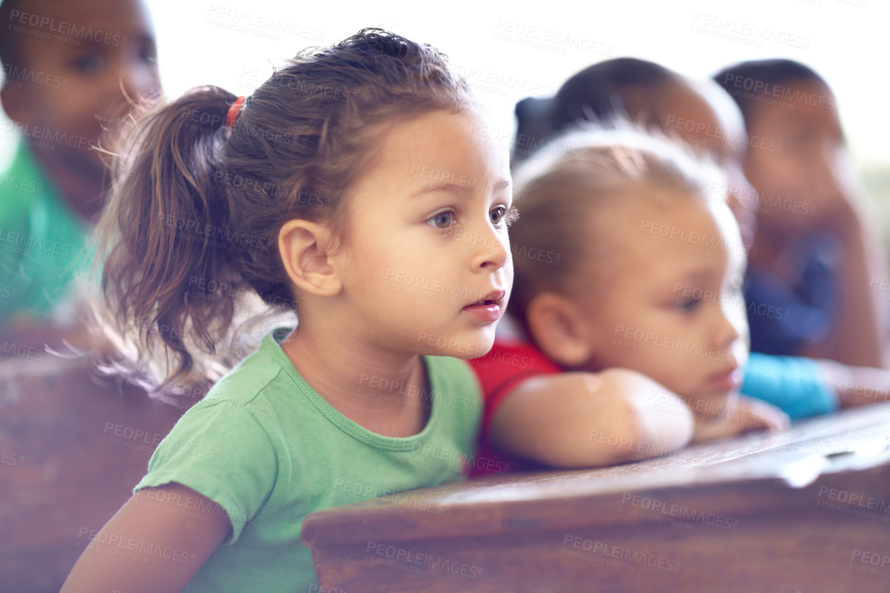 Buy stock photo Cute little preschoolers sitting in a classroom together