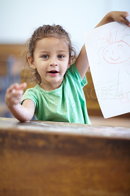 Buy stock photo Portrait, drawing and student in a classroom, girl and creative with happiness, learning and smile. Face, child or kid with paper, showing her art or excited with joy, school and study with education