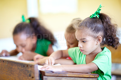 Buy stock photo Cute little preschoolers sitting in a classroom and drawing together