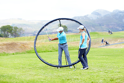 Buy stock photo Ring, sports woman or golfer in golf course lesson for fitness, workout or exercise with a swing on field. Coaching, golfing game or athlete training with instructor for driving with a club stroke  