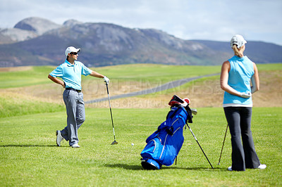 Buy stock photo Couple, teamwork or golfer playing golf for fitness, workout or exercise together on green course field. Healthy people, woman golfing or athlete training in action or sports game driving with clubs