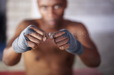 Buy stock photo Portrait of a young man standing in a fighting stance
