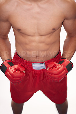 Buy stock photo Cropped image of a young boxer in front of a white background