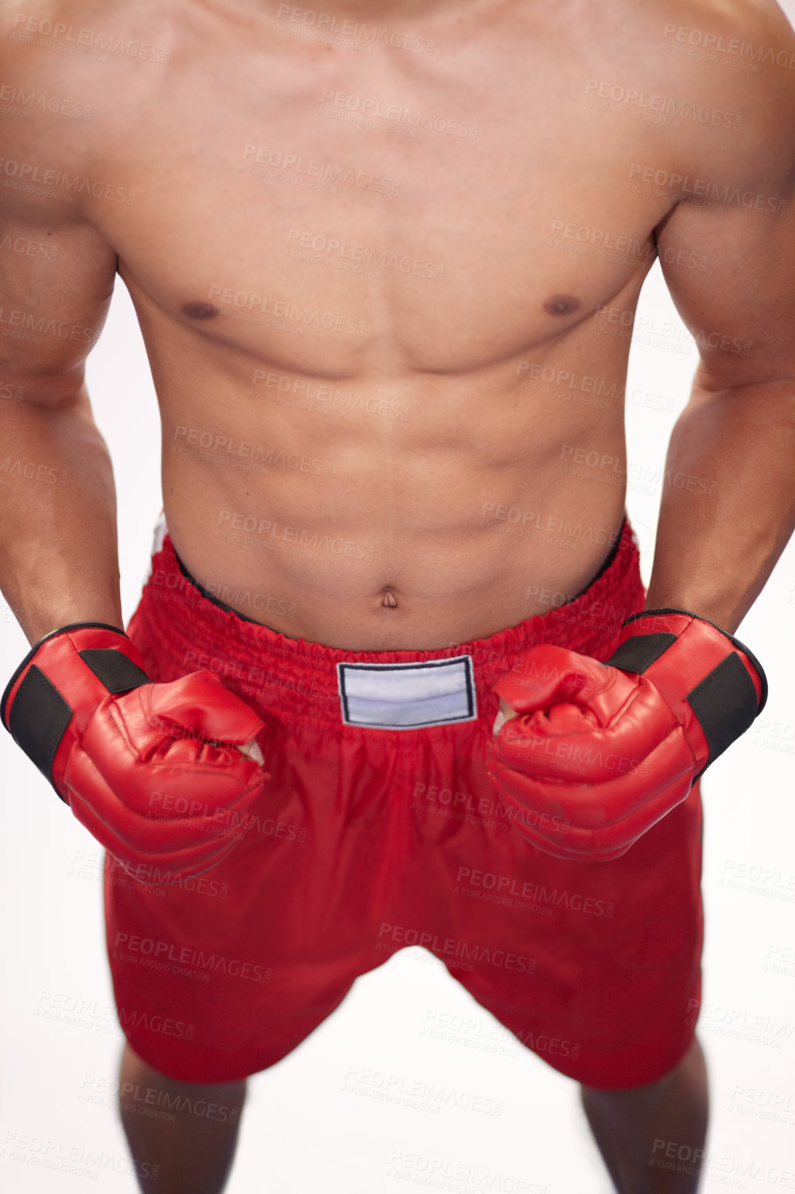 Buy stock photo Cropped image of a young boxer in front of a white background