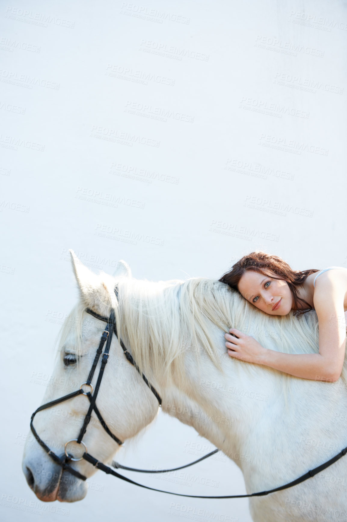 Buy stock photo Wall, portrait and woman laying on her horse outdoor for sports racing or riding hobby. Smile, happy and young person from Canada with her equestrian animal or pet by a ranch for adventure and love.