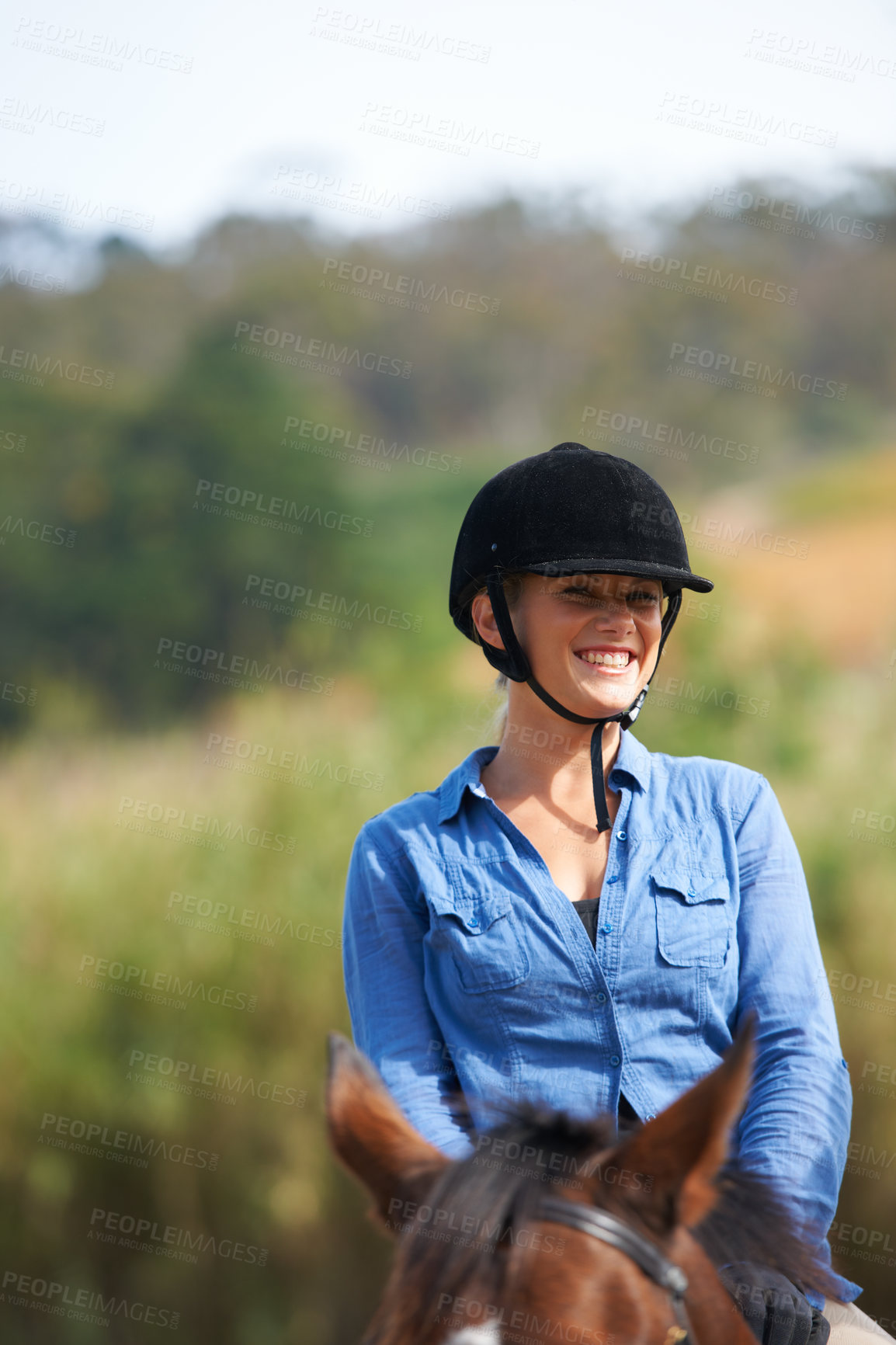 Buy stock photo Woman, horse riding outdoor and happy in portrait with helmet, ranger or exercise with equine pet. Girl, jockey and animal with smile on adventure, training or learning for competition in countryside
