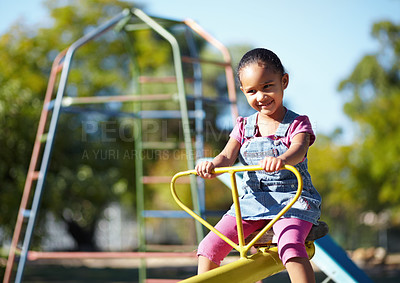 Buy stock photo Girl child, smile and seesaw at park, school or outdoor in spring for playful games, adventure or freedom. Kid, playground and happy in kindergarten, nature and summer sunshine with thinking by trees