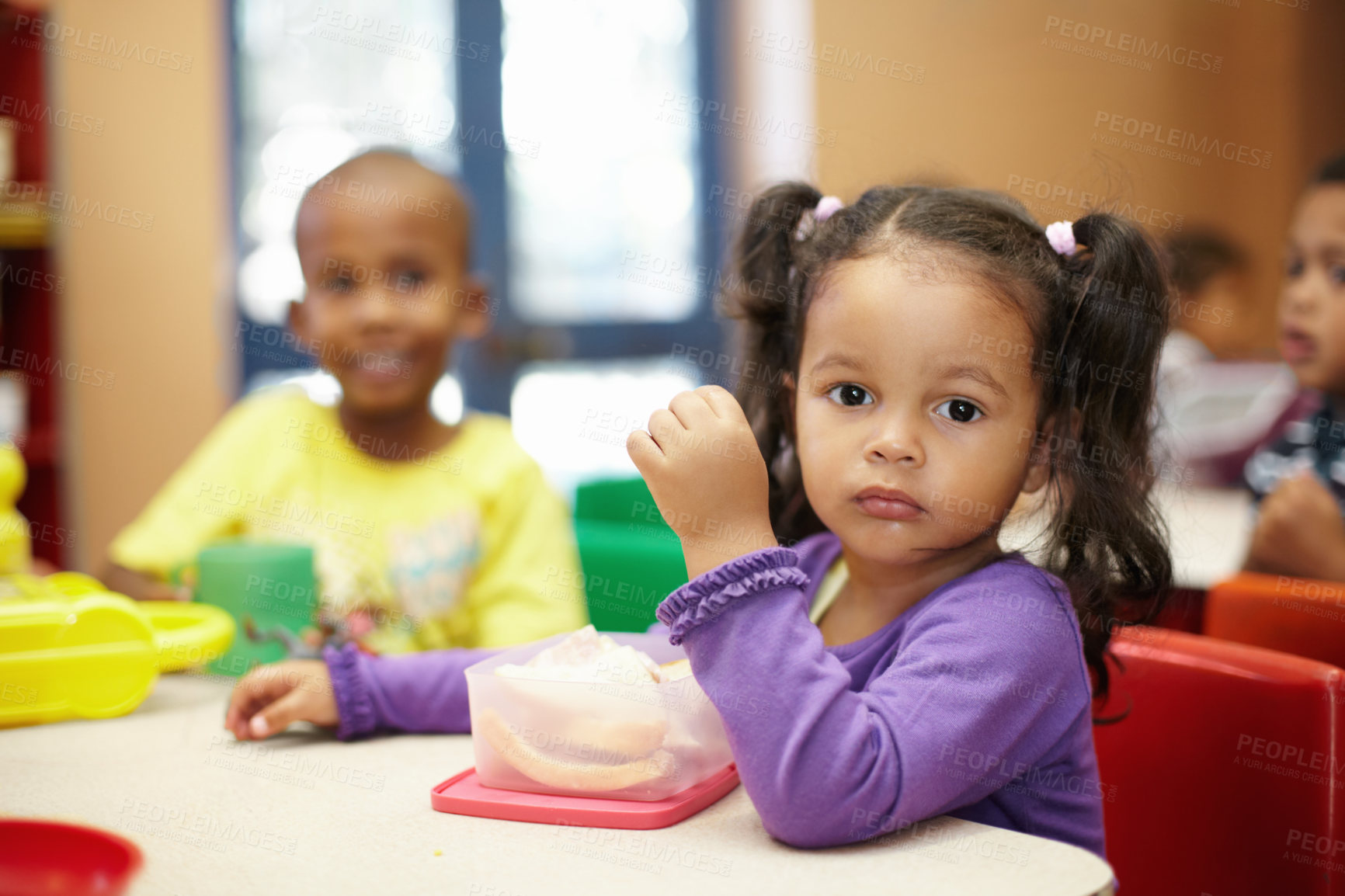 Buy stock photo Pre-school children on their lunch break eating sandwiches