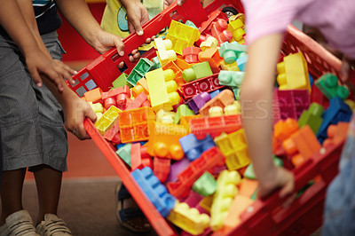 Buy stock photo Closeup, hands and kids with plastic blocks, colors and playing with fun, games and education. Zoom, children or young people in a classroom, school and playful with child development, box and creche