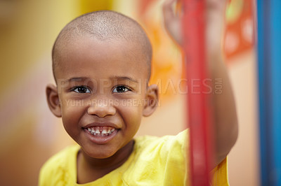 Buy stock photo African boy, portrait and smile in classroom at kindergarten with pride for development, scholarship or learning. Child, student and face at school, happy and education for future, growth or academy