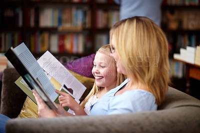Buy stock photo Reading, books and mom with child in library with smile, learning and relax, studying and knowledge. Storytelling, happy mother and girl on bookstore sofa together with story, fantasy and education.